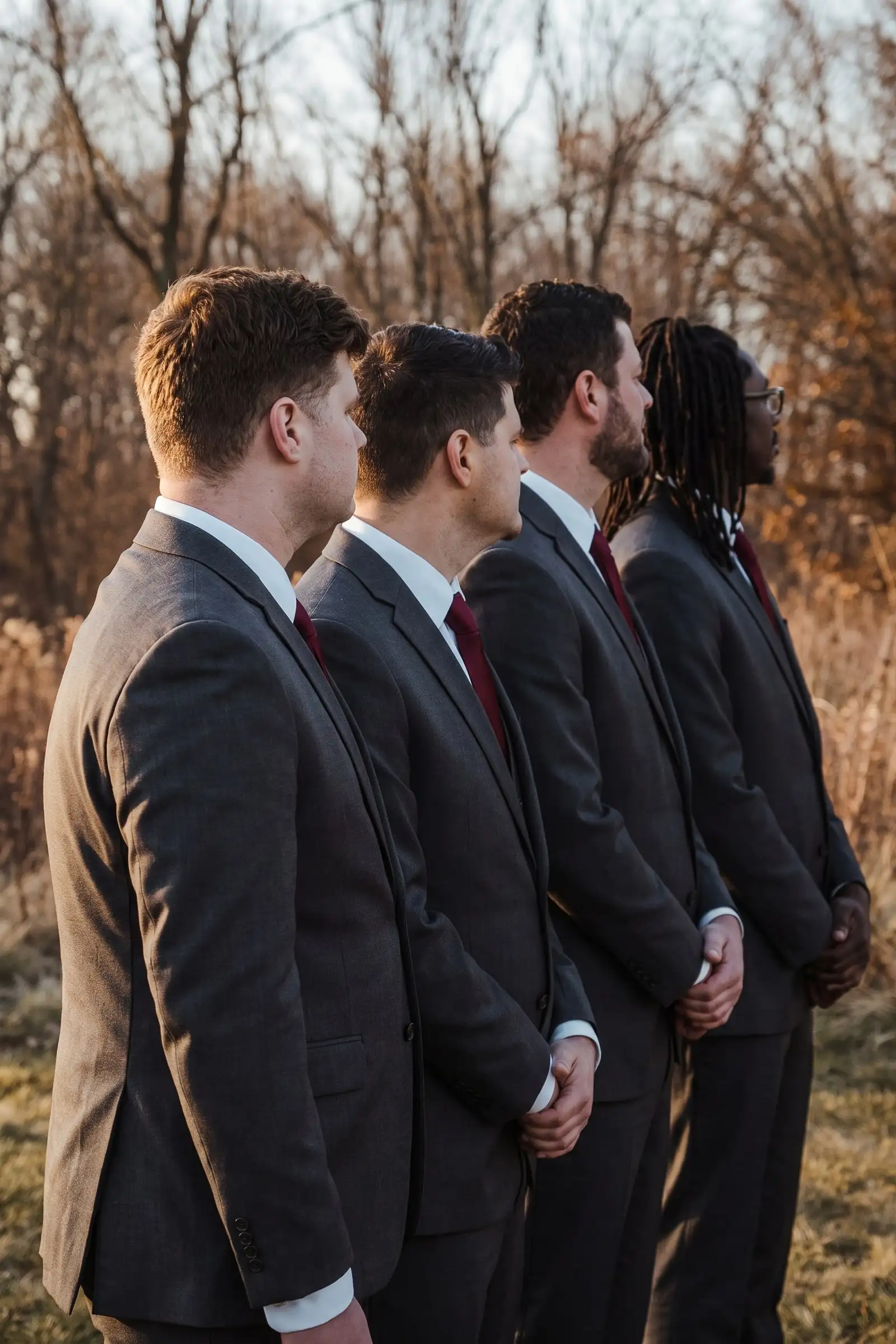 A groom with his groomsmen in matching suits