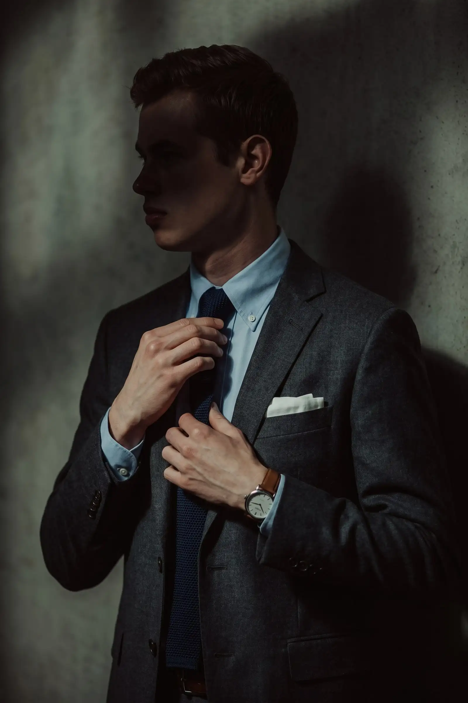 A young man in a sharp tailored jacket