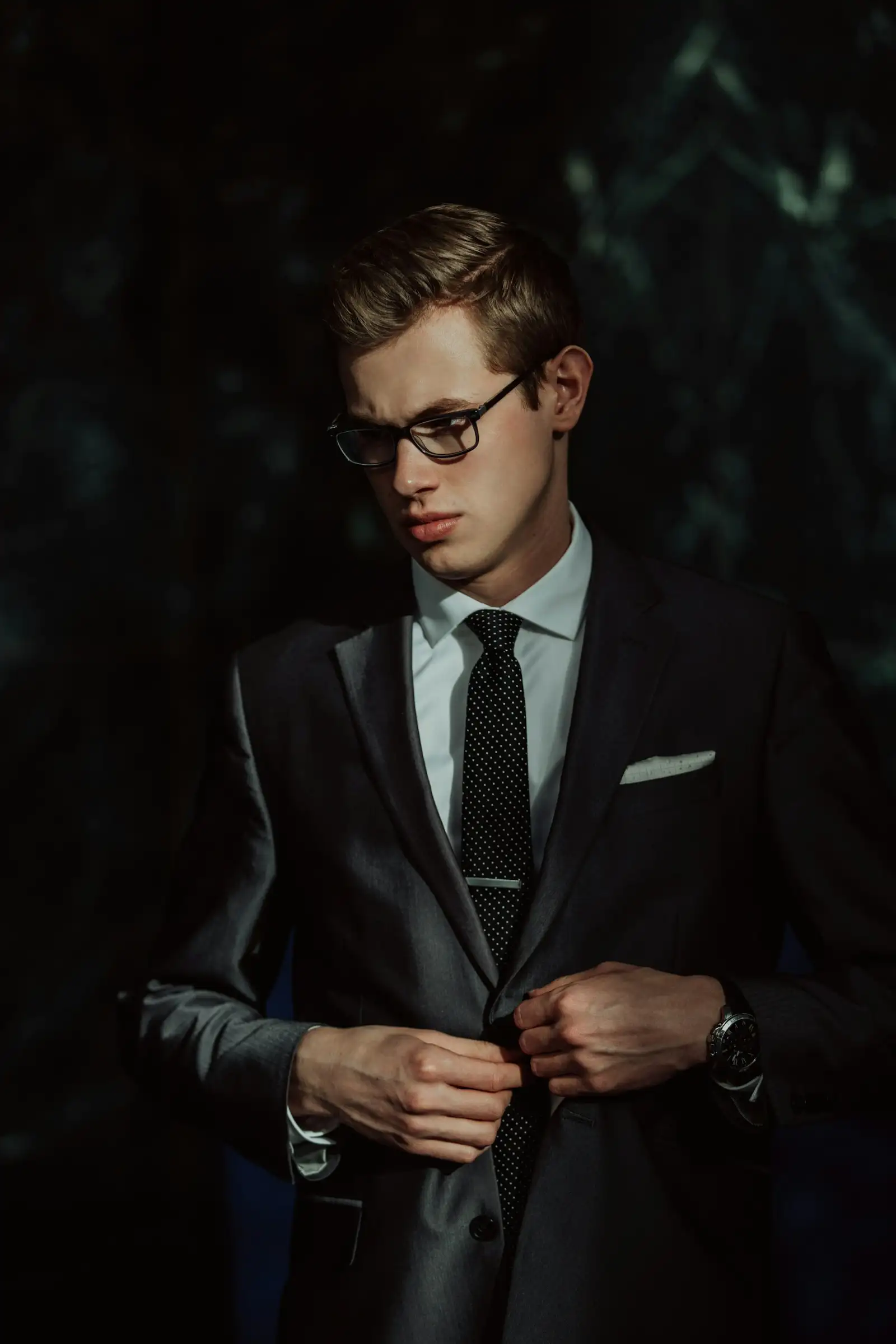 A young man in a sharp tailored jacket